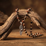 Rudraksha Karungali Malai in Silver-Cap with Vel Peacock Pendant